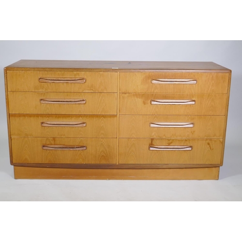 1063 - A G-Plan eight drawer teak side cabinet, 143 x 45 x 76cm