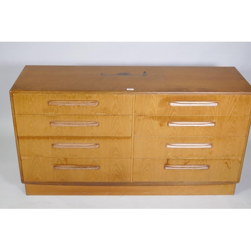 1063 - A G-Plan eight drawer teak side cabinet, 143 x 45 x 76cm