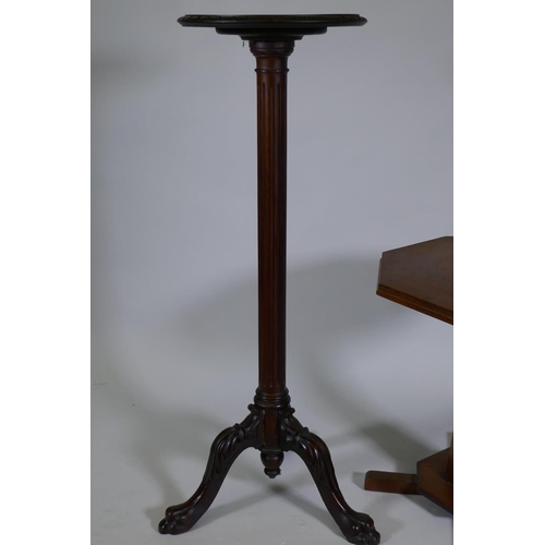 1066 - A Victorian mahogany torchere/jardiniere stand, raised on a fluted column with carved cabriole suppo... 