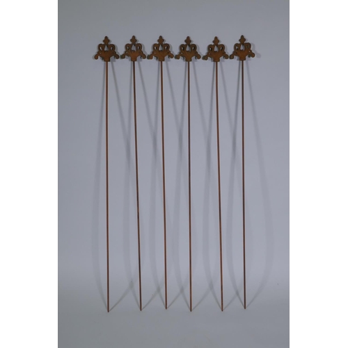 1077 - A set of six cast iron gothic style plant stakes, 106cm long