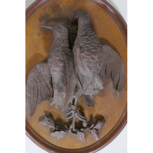 108 - A pair of C19th oak wall plaques with finely carved braces of woodland birds, 46 x 36cm