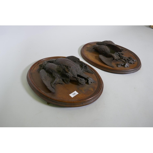 108 - A pair of C19th oak wall plaques with finely carved braces of woodland birds, 46 x 36cm