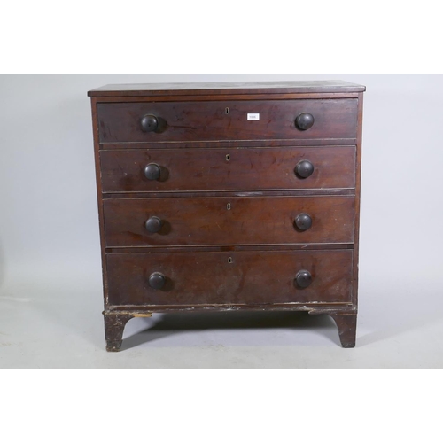 1086 - A Georgian mahogany chest of four long drawers, with cockbeaded detail and wooden knobs, raised on b... 