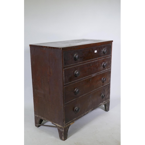 1086 - A Georgian mahogany chest of four long drawers, with cockbeaded detail and wooden knobs, raised on b... 