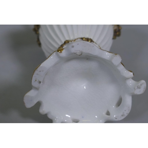 109 - A pair of Continental hard paste porcelain ewers with fine applied floral decoration and gilded high... 