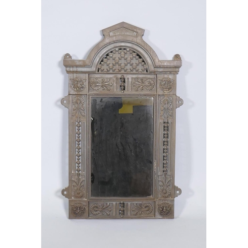 1091 - A Victorian Renaissance Revival cast iron framed wall mirror with lion mask decoration, and original... 