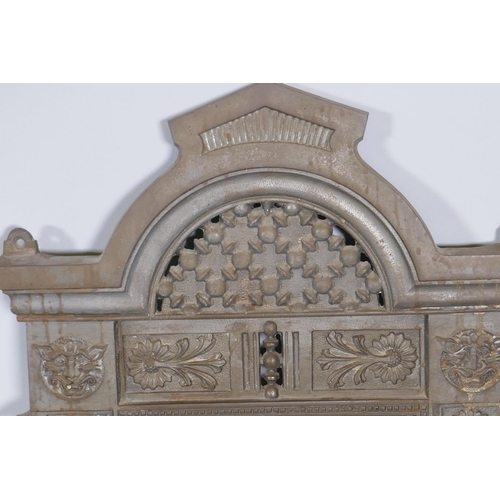 1091 - A Victorian Renaissance Revival cast iron framed wall mirror with lion mask decoration, and original... 