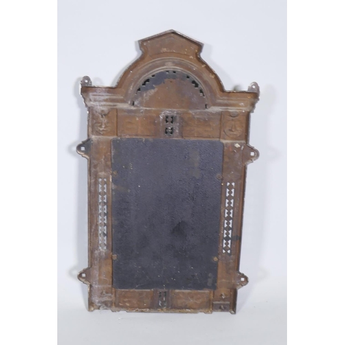 1091 - A Victorian Renaissance Revival cast iron framed wall mirror with lion mask decoration, and original... 