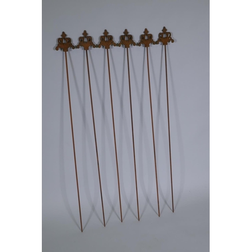 1095 - A set of six cast iron gothic style plant stakes, 106cm long