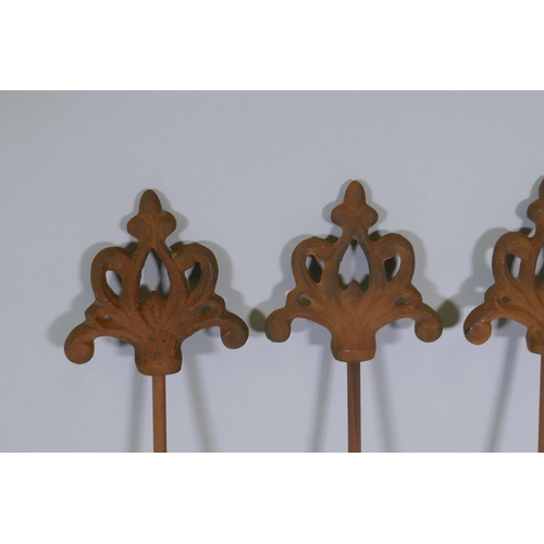 1095 - A set of six cast iron gothic style plant stakes, 106cm long