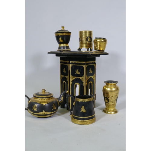 11 - A Burmese black lacquer and gilt table and tea set, table 30cm high