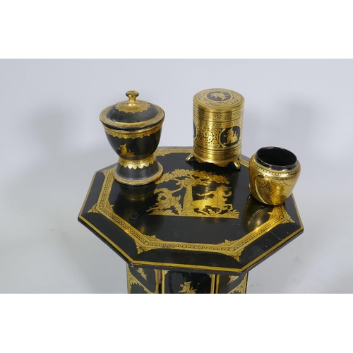 11 - A Burmese black lacquer and gilt table and tea set, table 30cm high