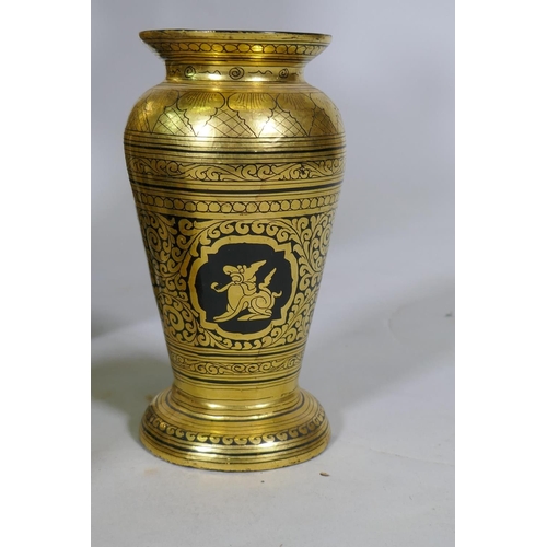 11 - A Burmese black lacquer and gilt table and tea set, table 30cm high