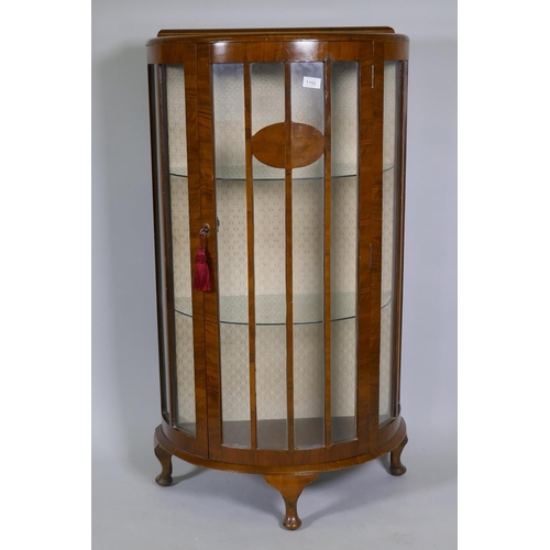 1102 - 1930s walnut demi lune display cabinet, raised on cabriole supports, 65 x 34 x 118cm