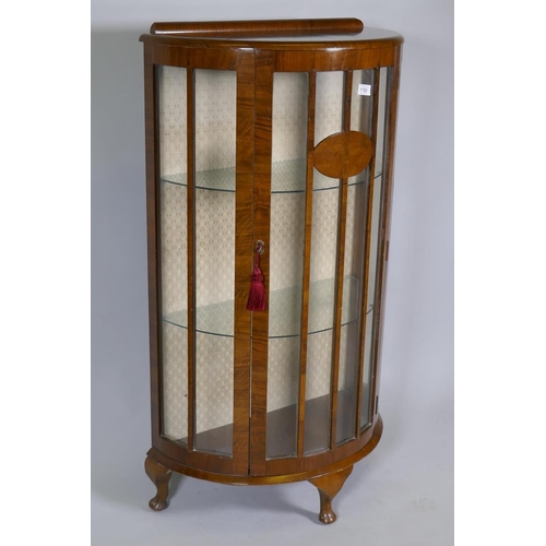 1102 - 1930s walnut demi lune display cabinet, raised on cabriole supports, 65 x 34 x 118cm