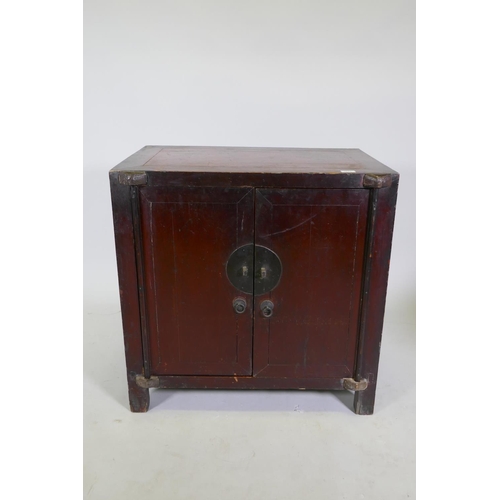 1105 - An antique Chinese red lacquered side cabinet with two doors, 78 x 50cm, 78cm high