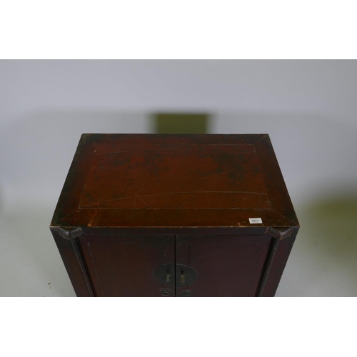 1105 - An antique Chinese red lacquered side cabinet with two doors, 78 x 50cm, 78cm high