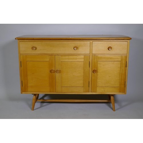 1109 - An Ercol Model 351 beech and elm top sideboard, with two drawers, one fitted with cutlery slide, ove... 