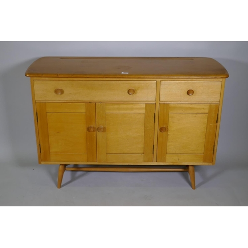 1109 - An Ercol Model 351 beech and elm top sideboard, with two drawers, one fitted with cutlery slide, ove... 