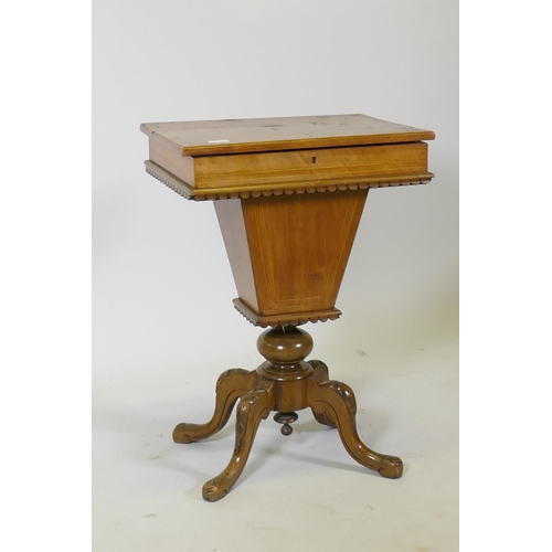 1118 - A Victorian inlaid walnut workbox, the rising top revealing a fitted interior, raised on carved cabr... 