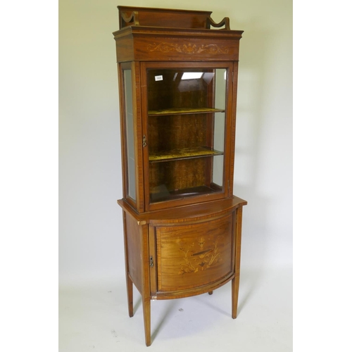 1125 - A Victorian inlaid mahogany bow front display cabinet raised on tapering supports, 67 x 45cm, 183cm ... 