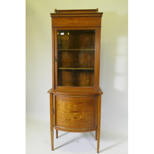 1125 - A Victorian inlaid mahogany bow front display cabinet raised on tapering supports, 67 x 45cm, 183cm ... 