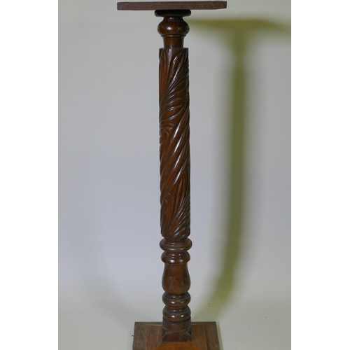 1129 - An antique Anglo Indian hardwood torchere with carved spiral leaf decoration to the column, 110cm hi... 