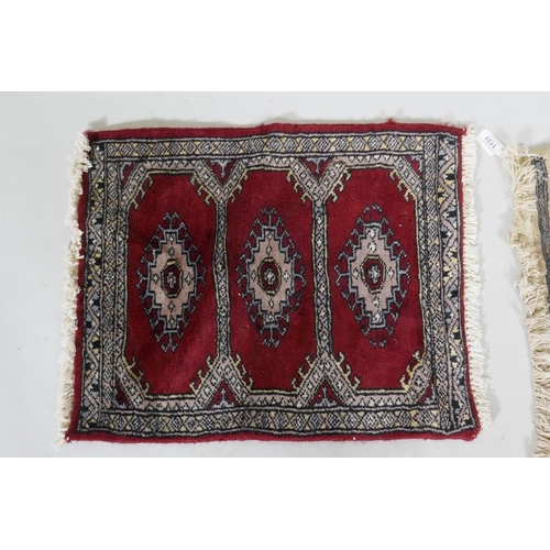 1133 - A hand woven wool Middle Eastern prayer rug, signed, 60 x 90cm, and another smaller