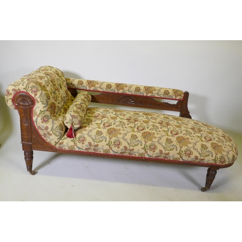 1138 - A Victorian walnut chaise longue with carved Grecian style decoration and good upholstery, 180cm lon... 