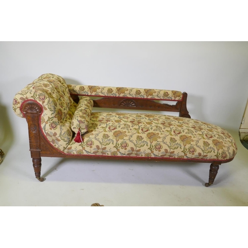 1138 - A Victorian walnut chaise longue with carved Grecian style decoration and good upholstery, 180cm lon... 