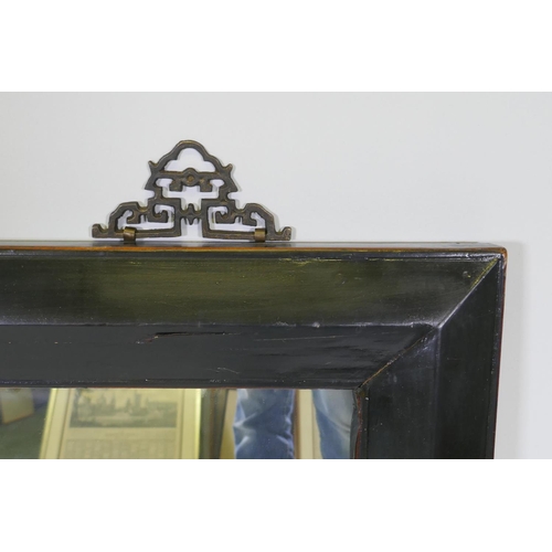 1143 - A Chinese black lacquer wall mirror with brass hangers, 100 x 80cm