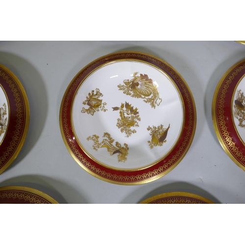 118 - A set of eleven Copeland china dessert dishes, with red borders and raised gilt decoration of sea-sh... 