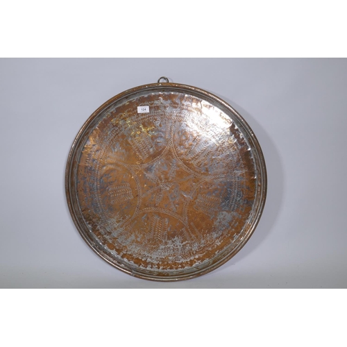 124 - A Middle Eastern silver plated on heavy gauge copper tray/wall plaque, plate rubbed