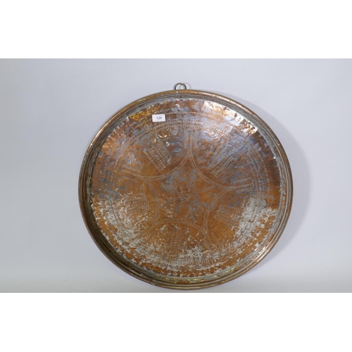 124 - A Middle Eastern silver plated on heavy gauge copper tray/wall plaque, plate rubbed