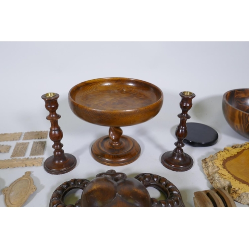 126 - A quantity of treen items, including furniture mounts, hammers, clothes brushes, turned wood bowls, ... 