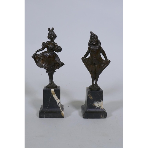 127 - Franz Iffland, a pair of bronze figures, Pierrot and a dancer, mounted on marble bases