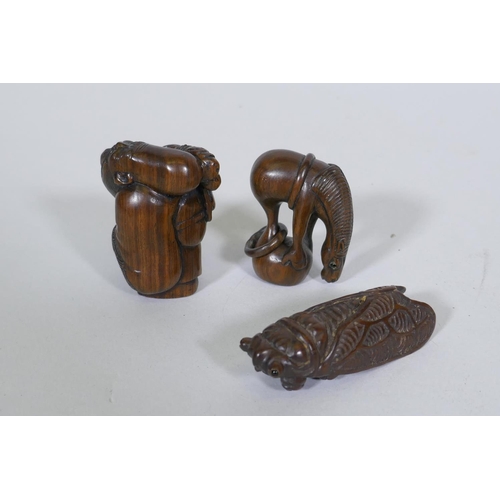 128 - A carved wood netsuke in the form of a cicada, 6.5cm long, a wood okimono of a balancing horse, sign... 