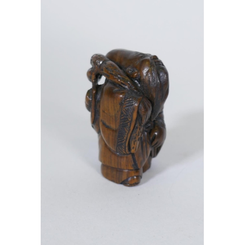 128 - A carved wood netsuke in the form of a cicada, 6.5cm long, a wood okimono of a balancing horse, sign... 