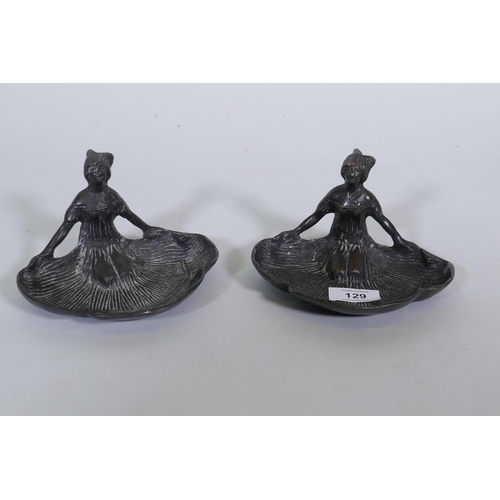 129 - A pair of bronze dishes in the form of kneeling women with fanned skirts, 10cm high