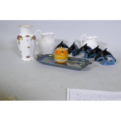 13 - Five Poole Pottery dolphin's, two Wedgwood Strawberry & Vine jugs, a Royal Albert Country Rose v... 