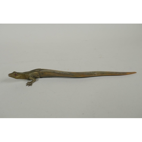 131 - A brass mounted horn letter opener in the form of a lizard, 26cm long