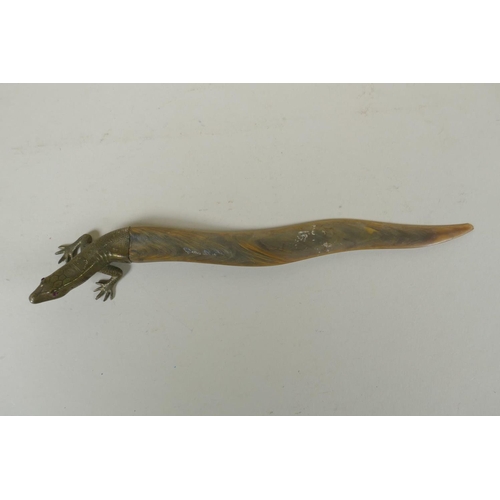 131 - A brass mounted horn letter opener in the form of a lizard, 26cm long