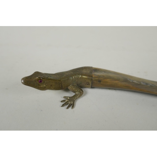 131 - A brass mounted horn letter opener in the form of a lizard, 26cm long