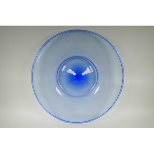 133 - A large Murano blue glass charger, on an associated Chinese hardwood stand, 63cm diameter