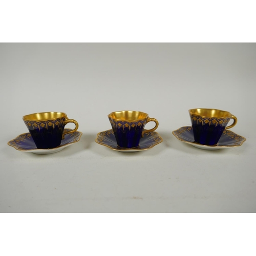 134 - An antique Coalport porcelain cabaret set of six cups and saucers, in cobalt blue and gilt, saucer 9... 