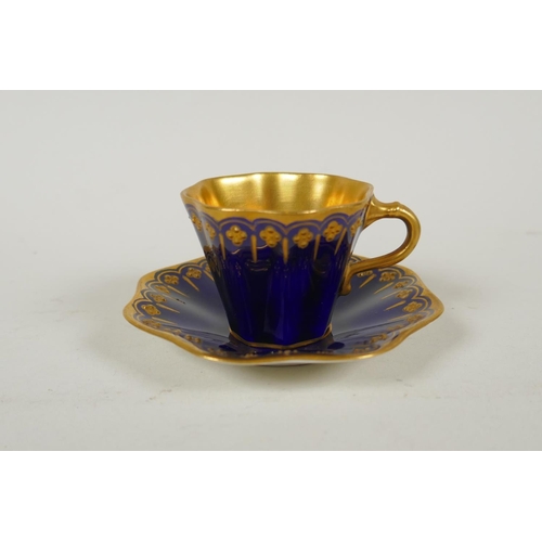 134 - An antique Coalport porcelain cabaret set of six cups and saucers, in cobalt blue and gilt, saucer 9... 