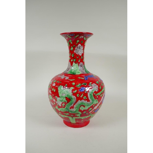 135 - A Chinese red ground porcelain fahua vase with dragon and phoenix decoration, HongZhi 6 character ma... 