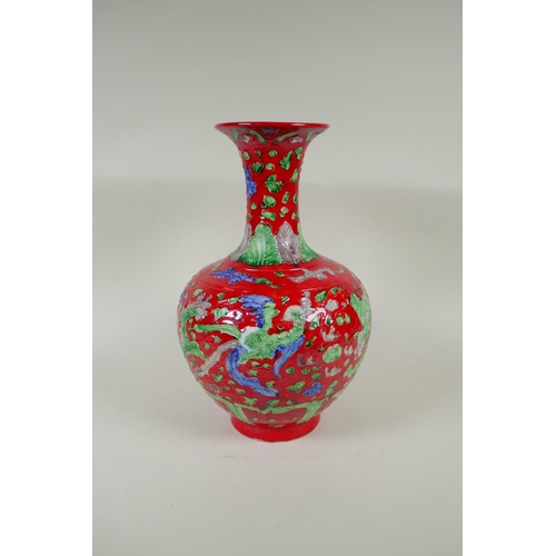 135 - A Chinese red ground porcelain fahua vase with dragon and phoenix decoration, HongZhi 6 character ma... 