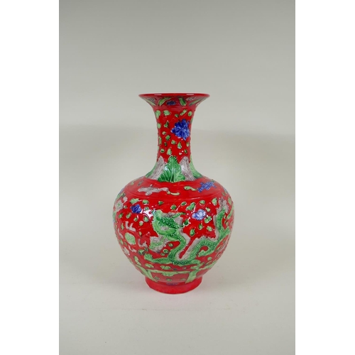 135 - A Chinese red ground porcelain fahua vase with dragon and phoenix decoration, HongZhi 6 character ma... 