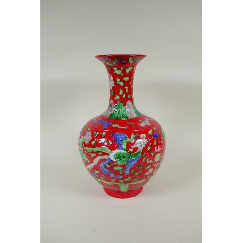 135 - A Chinese red ground porcelain fahua vase with dragon and phoenix decoration, HongZhi 6 character ma... 